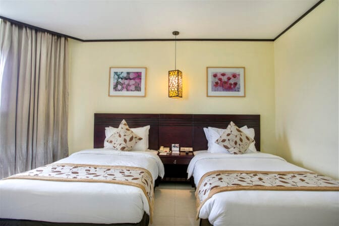 Experience the ultimate retreat in a Super Deluxe Twin (city or hill view) family room