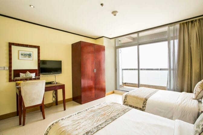 Each room features a private balcony, allowing guests to unwind while soaking in the picturesque surroundings.