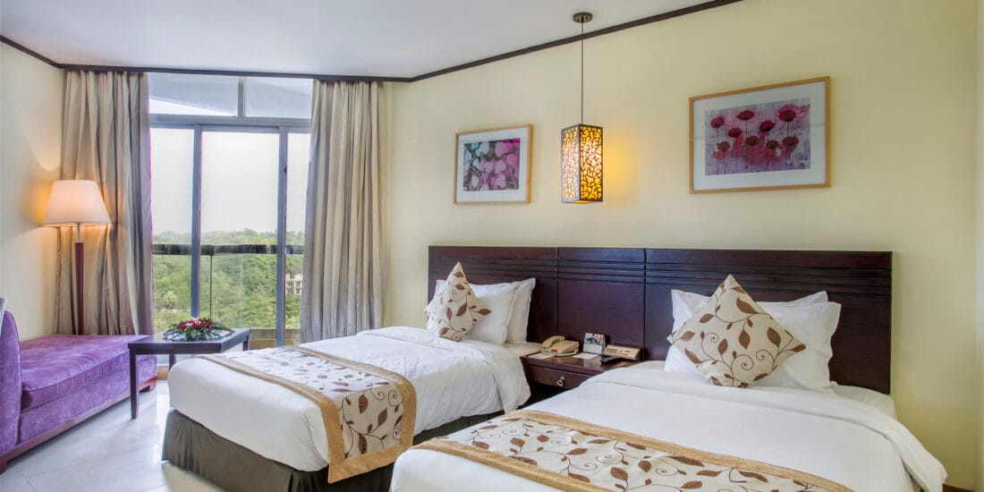 Experience the ultimate retreat in a Super Deluxe Twin (city or hill view) family room