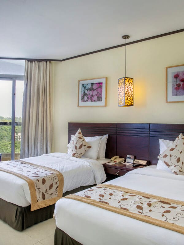 Experience the ultimate retreat in a Super Deluxe Twin (city or hill view) family room