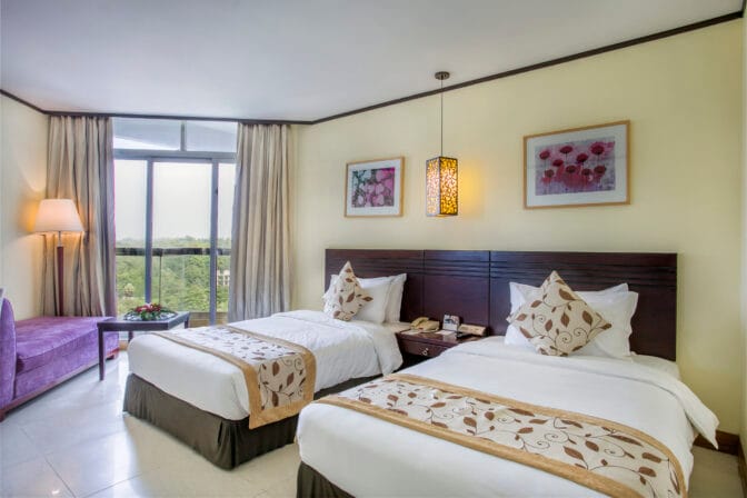 Experience the ultimate retreat in a Super Deluxe Twin (city or hill view) family room