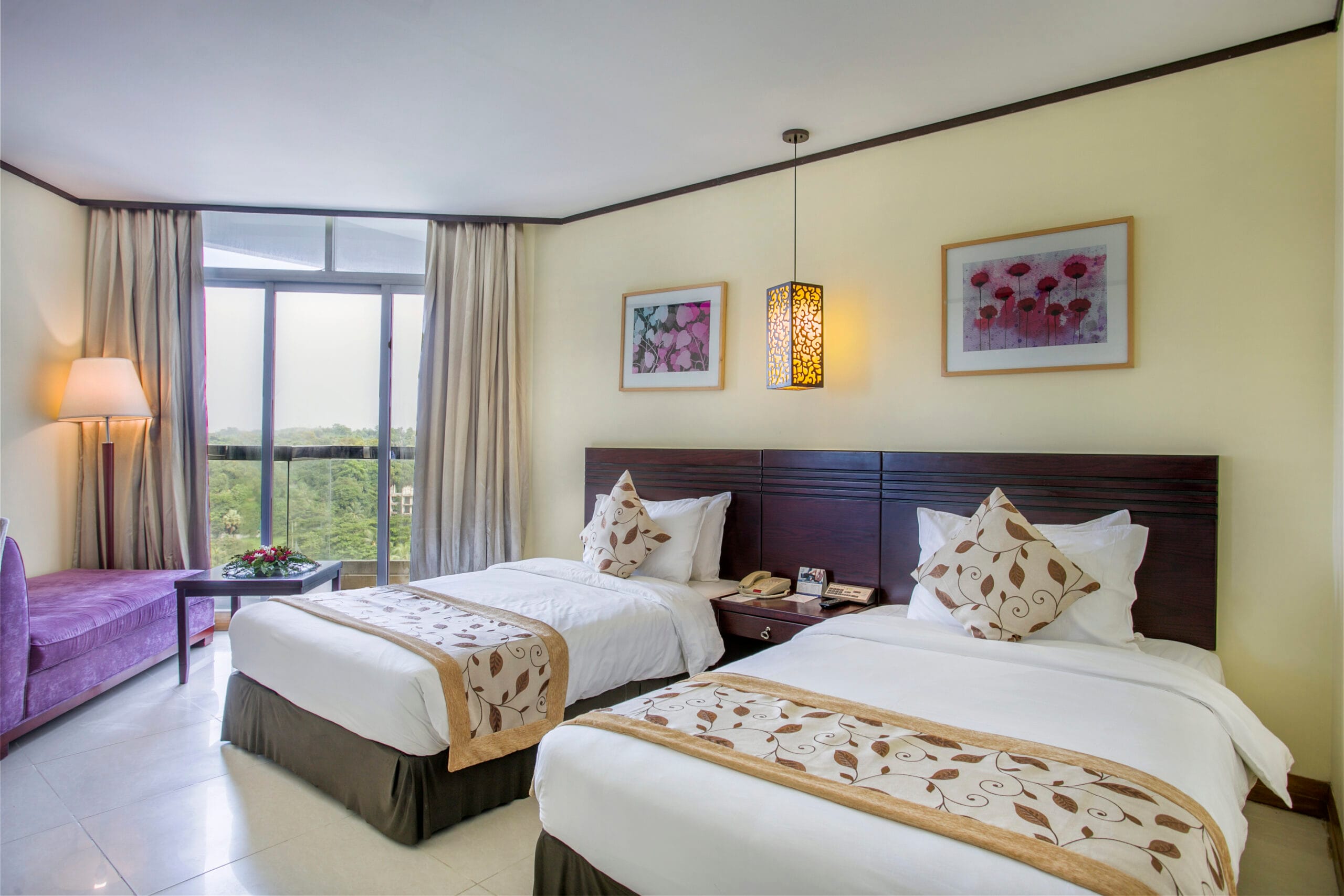 Experience the ultimate retreat in a Super Deluxe Twin (city or hill view) family room