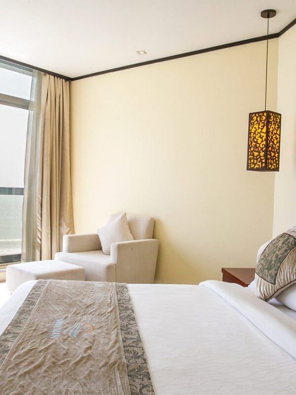Each room features a private balcony, allowing guests to unwind while soaking in the picturesque surroundings.