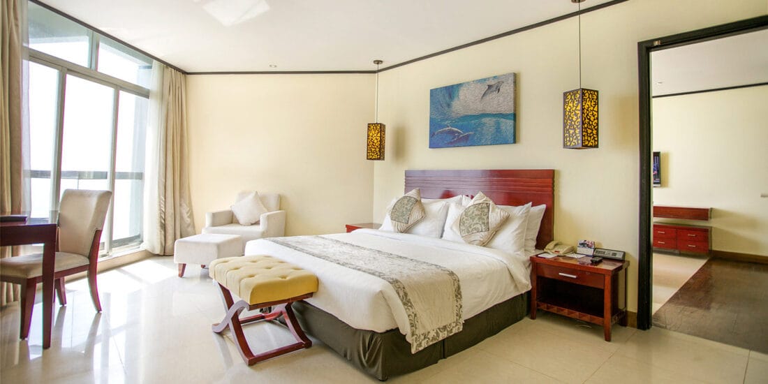 Each room features a private balcony, allowing guests to unwind while soaking in the picturesque surroundings.