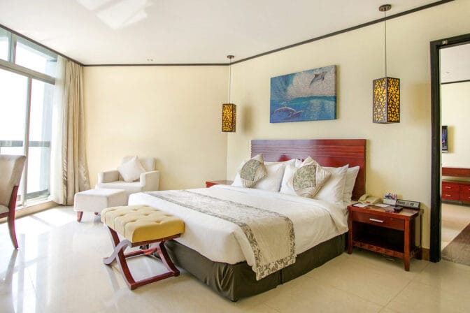 Each room features a private balcony, allowing guests to unwind while soaking in the picturesque surroundings.