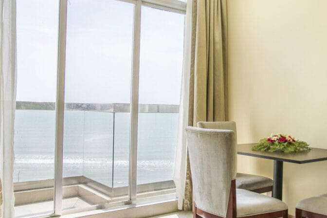 Each room features a private balcony, allowing guests to unwind while soaking in the picturesque surroundings.